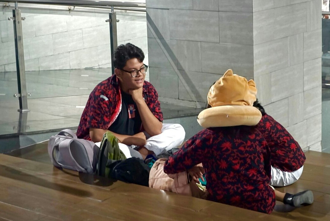 Tense discussion between two people in a meeting room